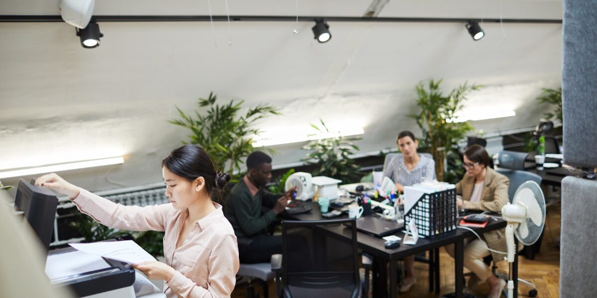 young-businesswoman-printing-documents-in-office-2026-01-08-07-42-42-utc
